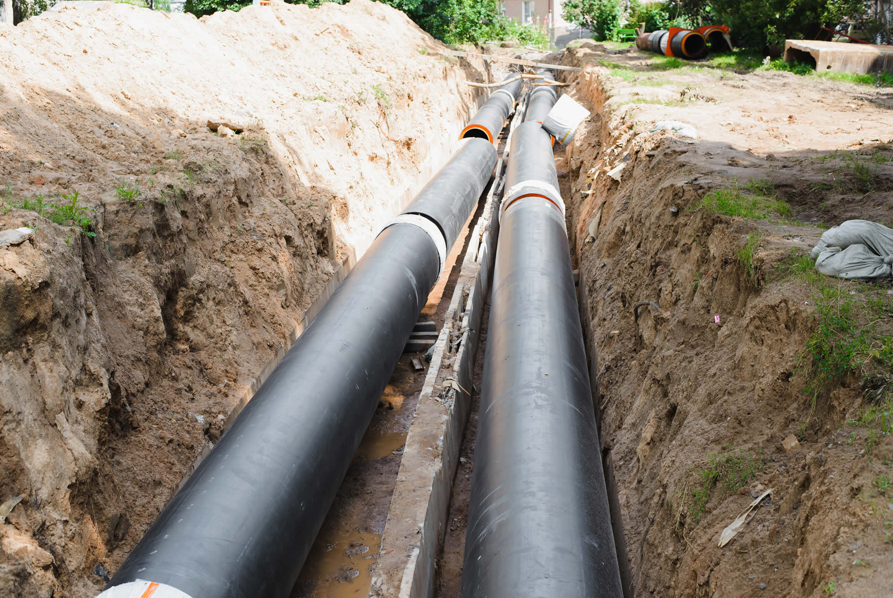 plumbing-repair-installation-new-industrial-street-water-pipes-dug-hole-two-lines-outdoors (1).jpg