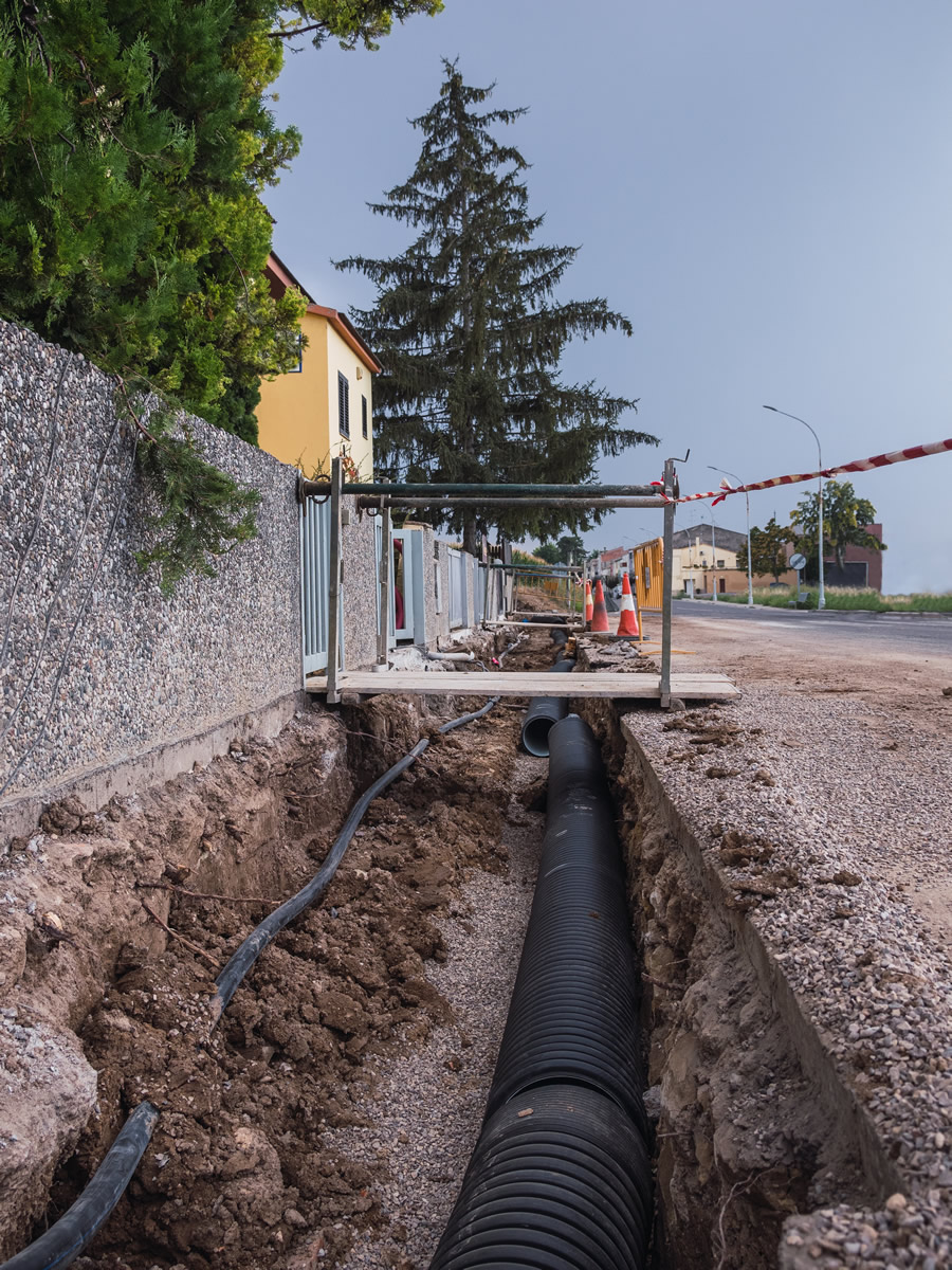 ditch-with-new-water-pipes-ground-residential-street-public-work-concept.jpg
